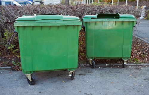 Professional garage clearance team assessing a cluttered Uxbridge garage
