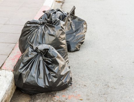 Front view of a commercial waste removal van in Uxbridge town centre