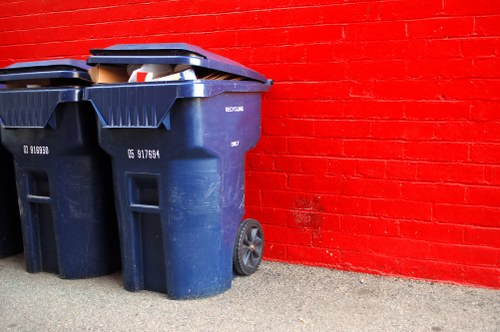 Stacked, labelled recycling containers for commercial waste in Uxbridge